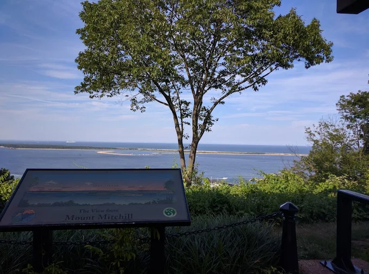 The marked overlook at Mount Mitchill in Atlantic Highlands, looking out over Sandy Hook and the bay